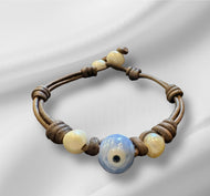 Women’s Evil Eye and Natural fresh water pearls on genuine hand rolled leather bracelet