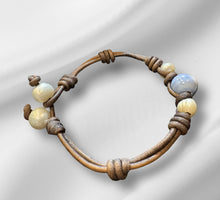 Load image into Gallery viewer, Women’s Evil Eye and Natural fresh water pearls on genuine hand rolled leather bracelet
