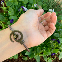 Load image into Gallery viewer, Women&#39;s adjustable bracelet with wild pearls and spiral clasp on antique grey leather
